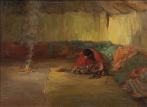 Portrait of a woman hunched over an empty baby carrier. She's wearing a red cover and is holding her hand to her head. She is seated inside a large wooden framed tent-like structure. A small fire is burning on the floor and piles of many colored cloth run around the base of the walls.